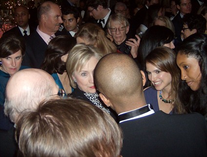 Hillary Clinton, Natalie Portman.  Background:  Henry Kissinger